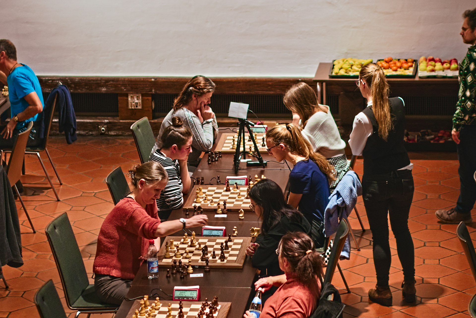 a group of people playing a game of chess